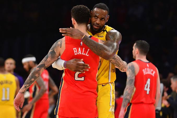 Lonzo Ball and LeBron James embrace